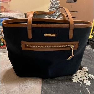 Michael Kors canvas navy and tan. Size 8H X 14W.   Perfect condition
